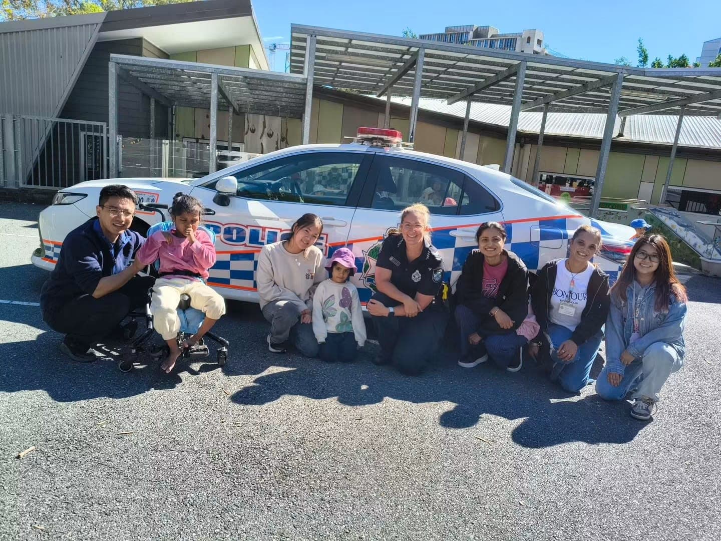 Children meeting local police officers during a community visit at the centre